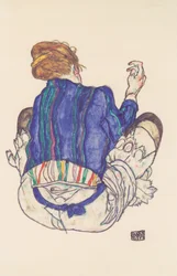 Rückenansicht einer sitzenden Frau